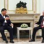 Washington condemns Xi visit of “dear friend” Putin