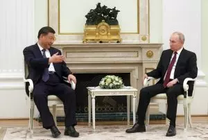 Washington condemns Xi visit of “dear friend” Putin