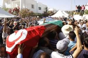 Tunisian court issues death sentences for political leader’s murder