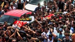 Palestinian-American killed by settlers buried in West Bank
