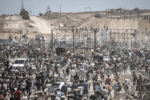 Two Palestinians killed while waiting for aid