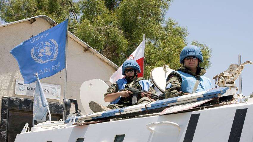 UN forces raise flag near Israeli base